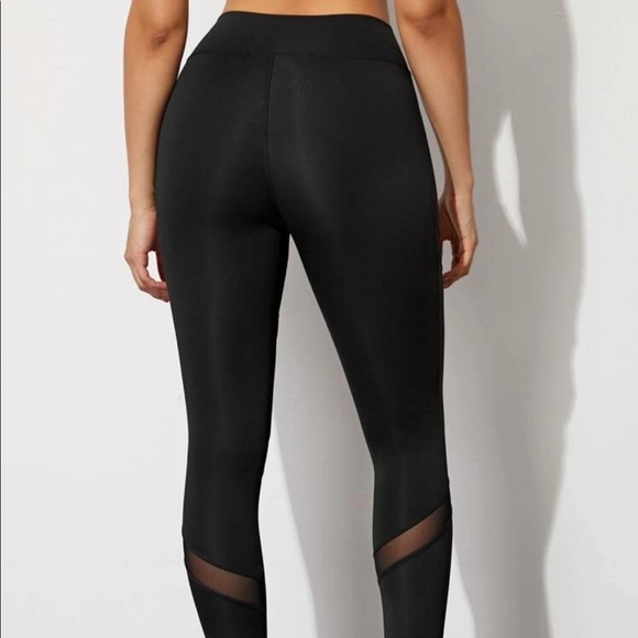 Black workout leggings with mesh cut out detail. - Picture 2 of 3